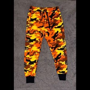 Young & Reckless Orange Camouflage Sweatpants with Multiple Logo Detailing